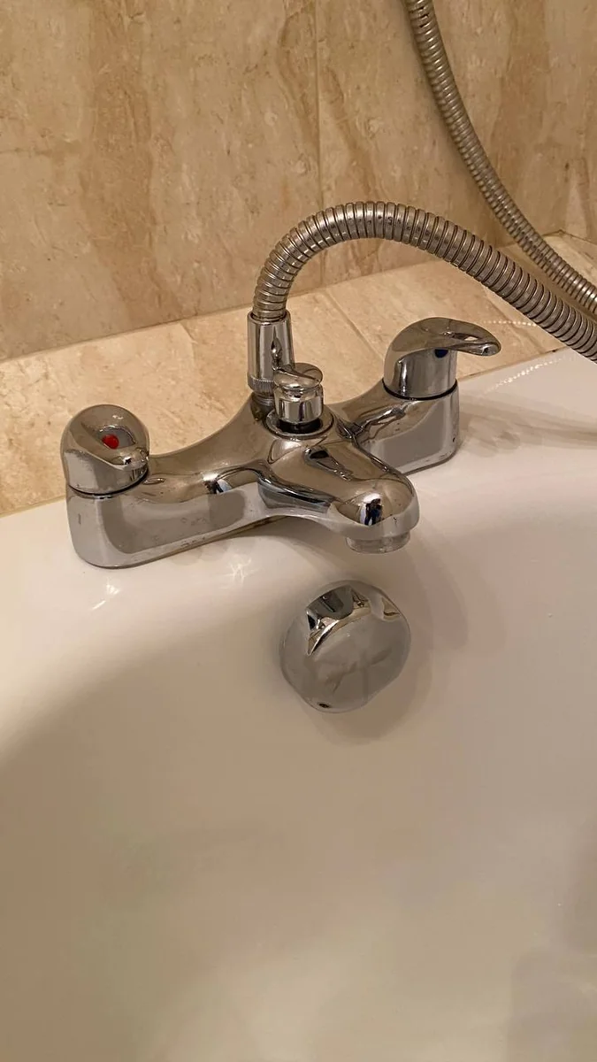 Bath mixer tap polished to a shine after descaling