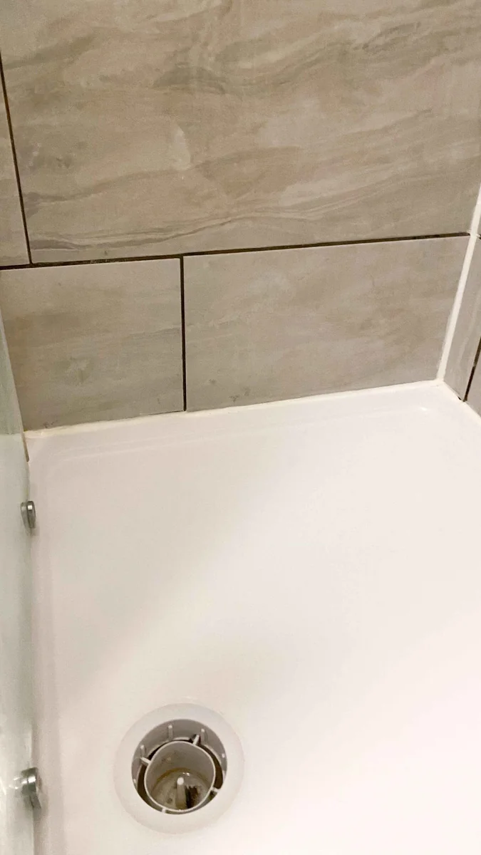 Shower tray and drain spotless after a deep clean