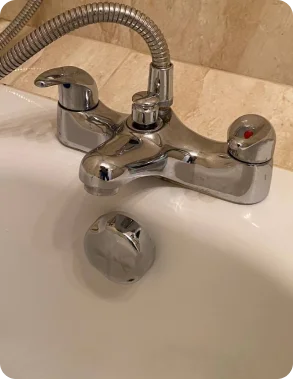 The same bath tap after the deep clean, limescale removed